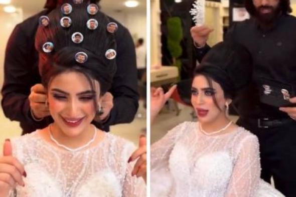 تراند اليوم : شاهد .. عروس عراقية تزين تسريحة شعرها بصور لاعبي المنتخب العراقي